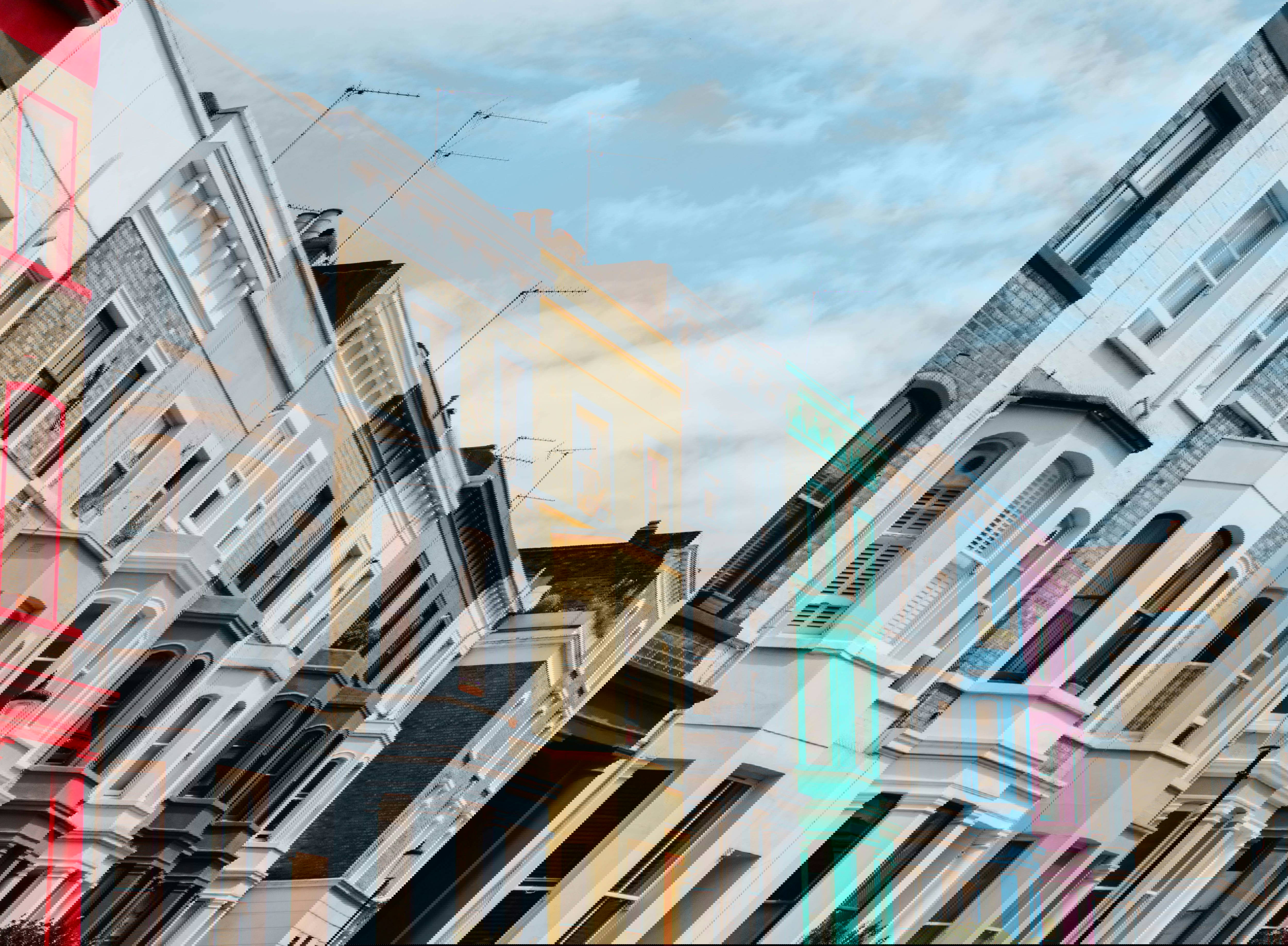 The view down a road of different coloured houses