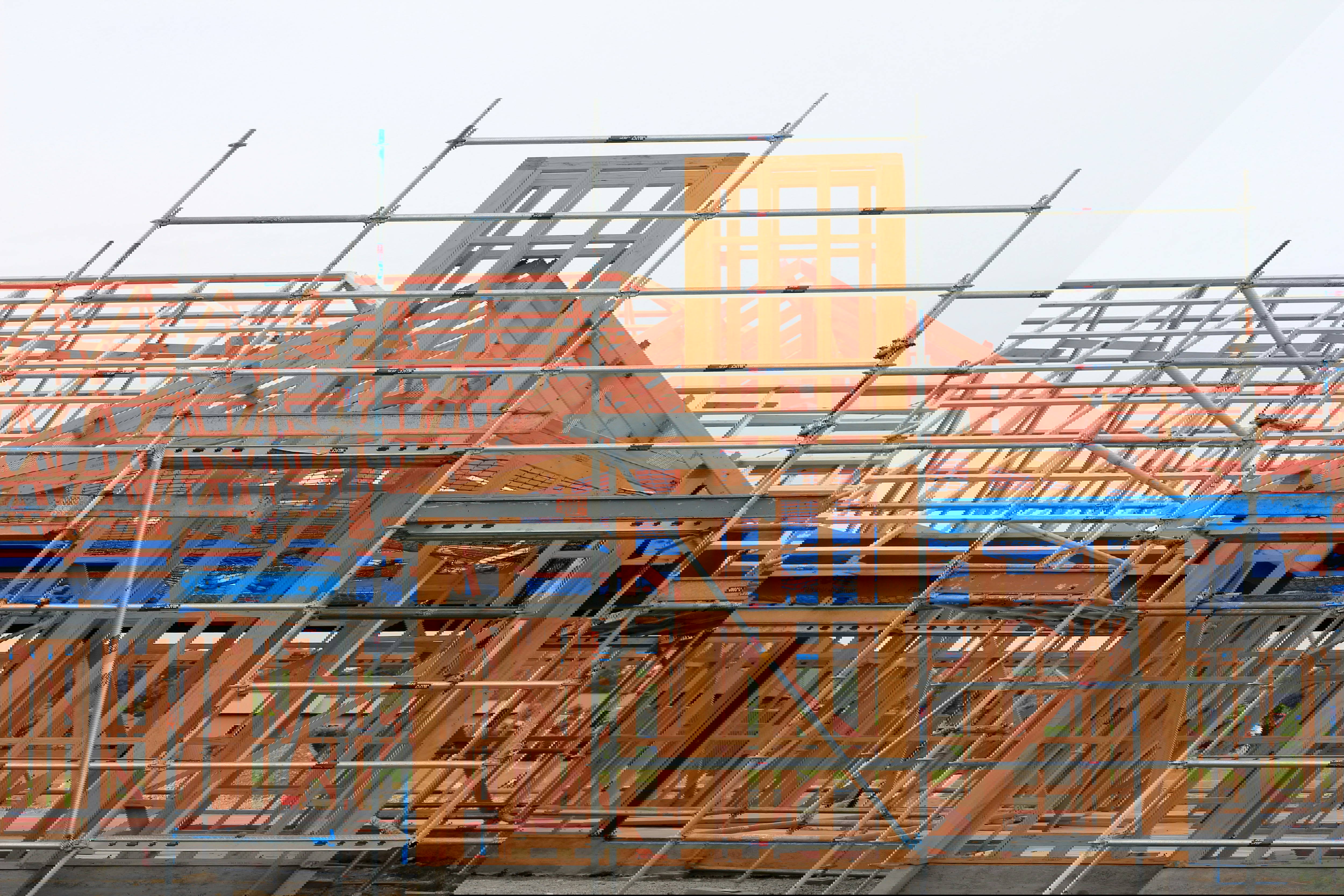 A house under construction with scaffolding
